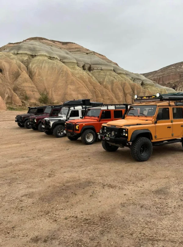 Close-up of a professional safari Jeep driving on the dusty paths of Cappadocia.