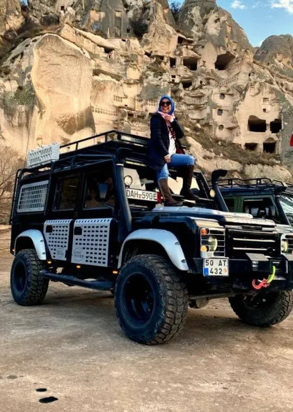 VIP Jeep safari guests enjoying a champagne toast in a scenic Cappadocia valley.